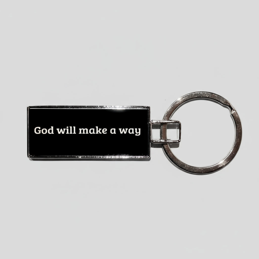 Keychain with 'God will make a way' text on a textured surface