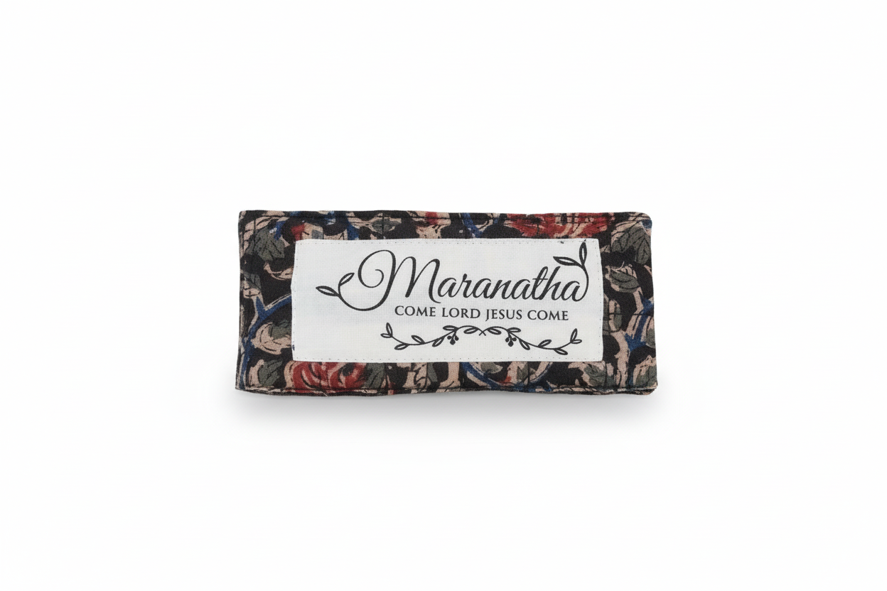 Decorative mat with 'Maranatha' and 'Come Lord Jesus Come' text on a textured surface.