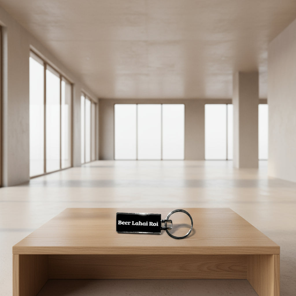 Keychain with 'Beer Lahai Roi' text on a light gray background