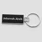 Keychain with 'Jehovah Jireh' text on a black background