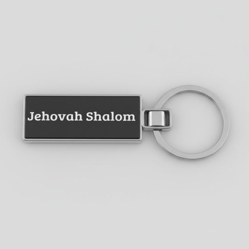Black keychain with 'Jehovah Shalom' text on a light gray background