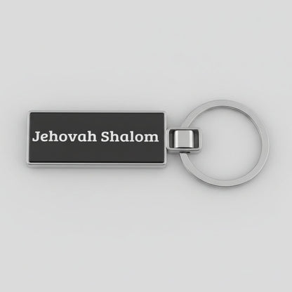 Black keychain with 'Jehovah Shalom' text on a light gray background