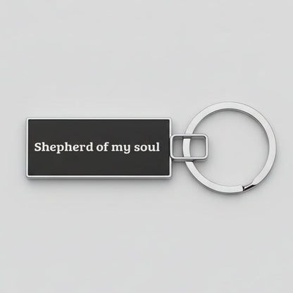 Keychain with 'Shepherd of my soul' text on a textured gray background
