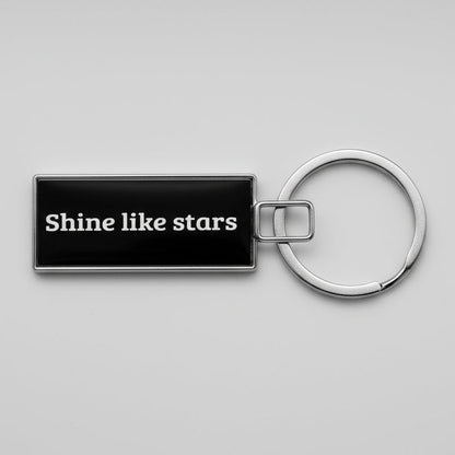 Keychain with 'Shine like stars' text on a textured gray background